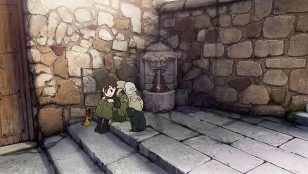 Kanata sits on stone steps in Seize